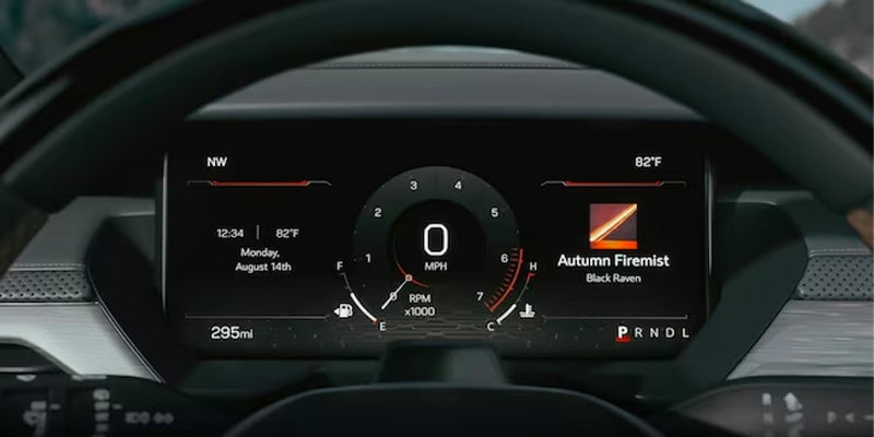 view of the MPH gauge displayed on a screen above the steering wheel in a 2024 GMC Acadia