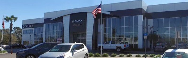 View of the front of the Century Buick GMC Dealership in Tampa, FL on a sunny day